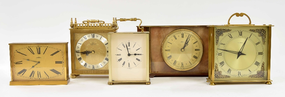 Angelus electronic mantel clock within a brushed brass case, 4.25" high; also four other gilt