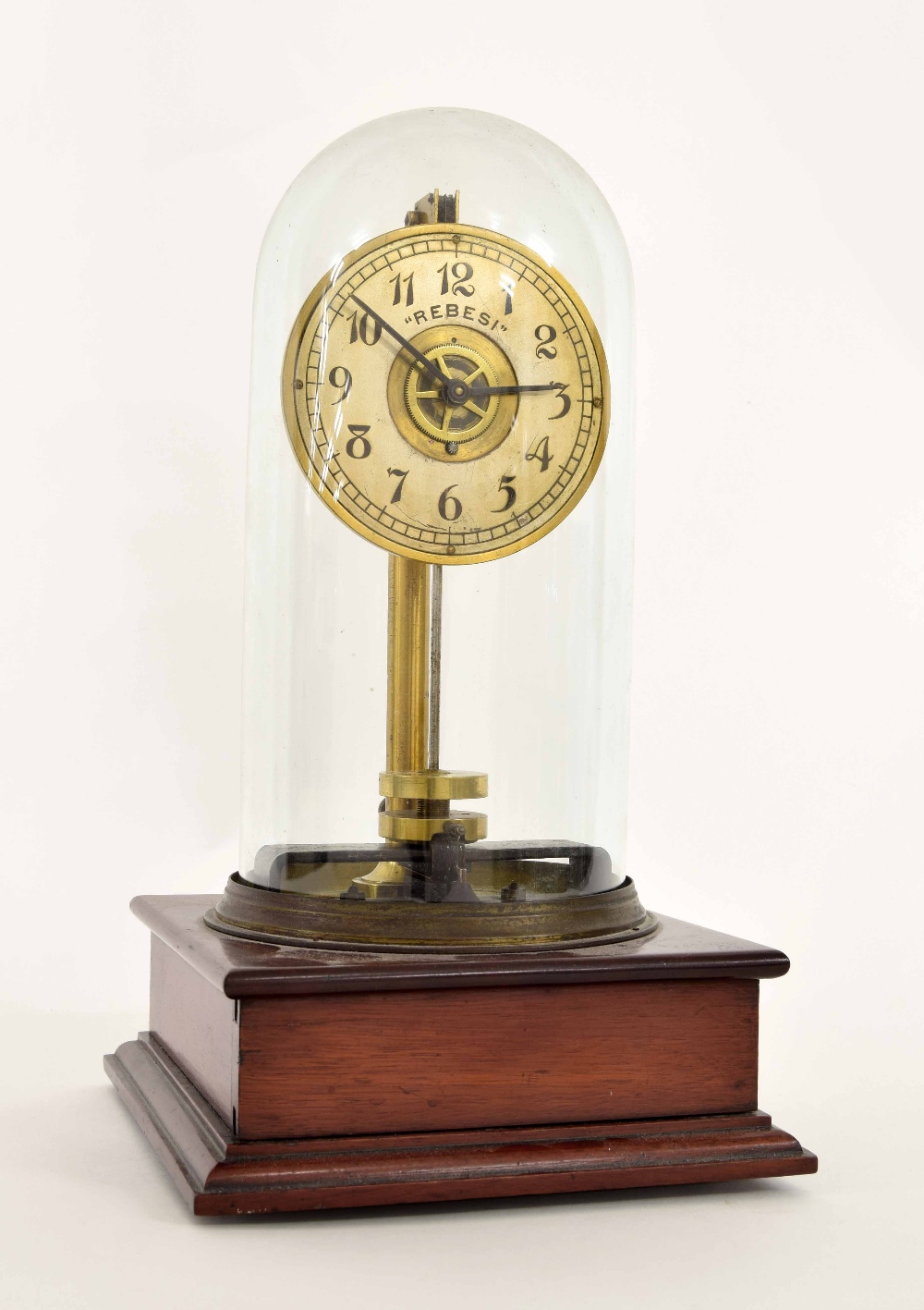 'Rebesi' electric mantel clock, the 3.5" silvered dial under a glass dome and upon a stepped