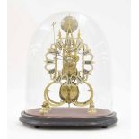 Brass single fusee skeleton clock, the pierced silvered dial and movement upon rounded supports