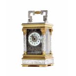 Miniature French brass and silvered carriage clock timepiece, the back plate and face bearing the