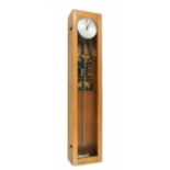 Electric master clock with switch gear, the 6.25" silvered dial within a light oak glazed case, 49.7