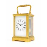 Repeater carriage clock striking on a gong, within a corniche gilded brass case, 6.25" high