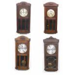 Two oak cased three train wall clocks; also two oak cased two train wall clocks, all approximately