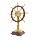Ormolu and mahogany novelty ship's wheel clock, the 1.75" dial bearing the maker's trademark logo