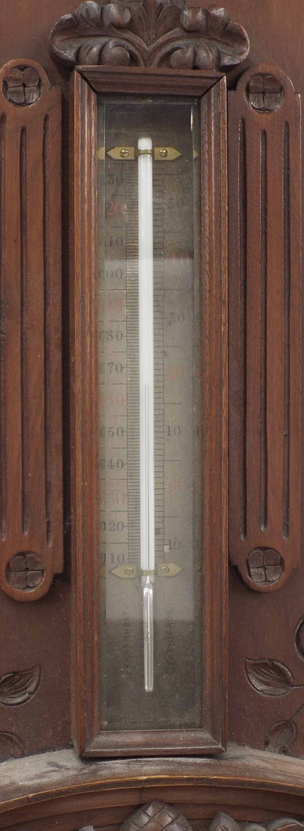 Mahogany aneroid barometer/thermometer, the 8" silvered dial within a foliate carved case surmounted - Image 2 of 3