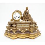 French spelter and alabaster two train drumhead figural mantel clock, upon a shaped giltwood