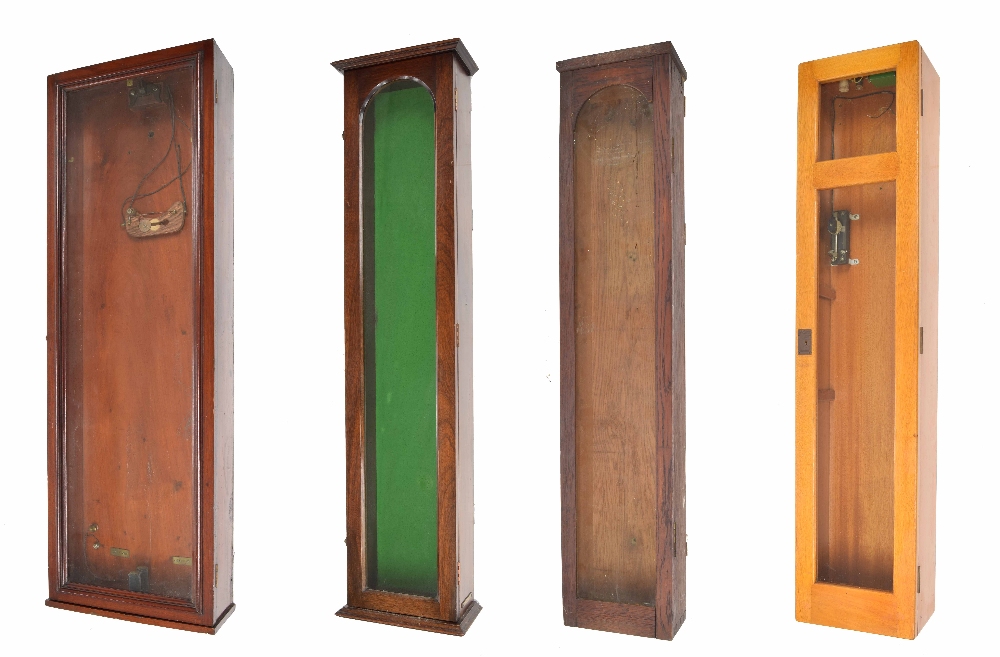 Four various electric master clock glazed cases, all approx 50.5" high (4)