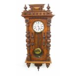 Walnut double weight Vienna regulator wall clock, the 7" white dial with subsidiary seconds dial,