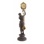 Ansonia spelter figural mystery clock, 3.5" cream dial within a drumhead casing over the pendulum