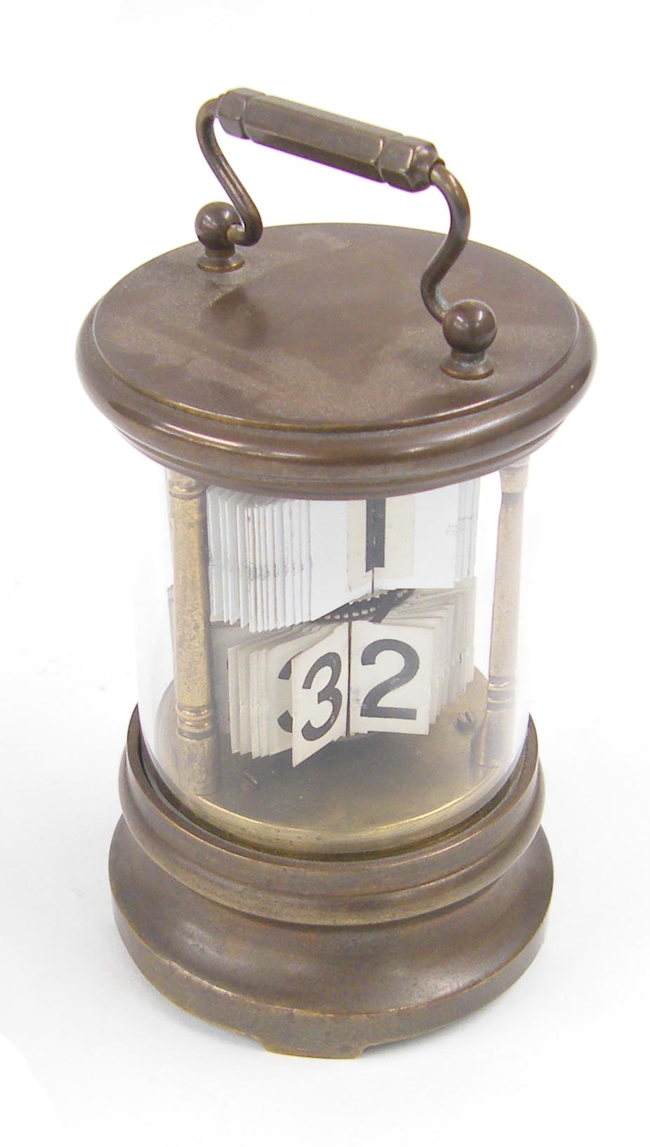 Cylindrical brass ticket clock with carrying handle, 6.5" high