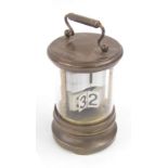Cylindrical brass ticket clock with carrying handle, 6.5" high