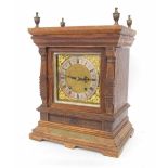 German oak ting-tang mantel clock, the W & H movement striking on two gongs, the 7" square brass