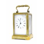Brass carriage clock striking on a bell and in need of restoration, 6.5" high