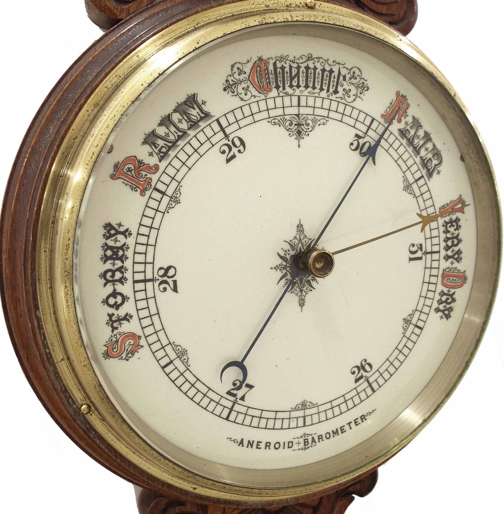 Oak aneroid barometer/thermometer within a foliate carved case - Image 2 of 3