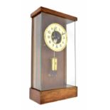 Good electric clock in the manner of Cluse, the 6.5" cream dial enclosing a skeletonised centre with