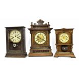 German two train mantel clock striking on a gong, within an architectural stepped carved case, 17"