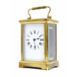 French carriage clock timepiece within a corniche brass case, 6" high (key)