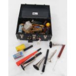 Box containing a selection of blown and hand operated percussive sound effects