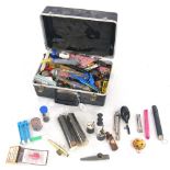 Case containing a selection of small blown and hand operated effects