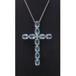 Impressive 18k white gold topaz cross pendant, consisting of ten oval pale blue topaz, each 1.00ct