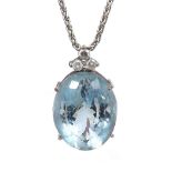 18ct white gold aquamarine and diamond pendant on a slender necklace, with thee round brilliant-