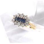 18ct and platinum sapphire and diamond cluster ring, with three princess-cut sapphires in a