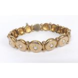 Antique gold diamond set dice bracelet, with graduating panels including seven set with single old-