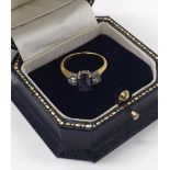 Coppins of Corsham - 18ct sapphire and diamond three stone ring, with a white gold claw setting with