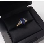 Tanzanite and diamond 14k ring, the oval tanzanite estimated 1.65ct approx, with three round