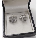 Good pair of 18k white gold diamond cluster earrings, each with seven round brilliant-cut