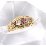 Antique 18ct ruby and diamond five stone ring in a carved setting, with three round rubies and two