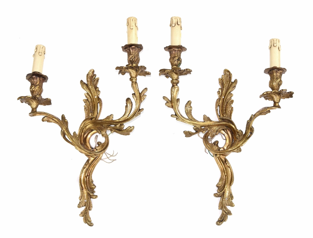 Pair of French rococo style ormolu twin sconce wall lights, of foliate form, 21" high (2)
