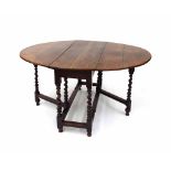 18th century oak oval gateleg table, the drop leaf top over twist supports united by stretchers, 29"