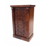 Victorian flame mahogany miniature Wellington chest, with eight graduated drawers and applied with