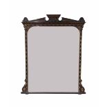Large Edwardian aesthetic movement ebonised overmantel mirror, the arched shaped plate within a