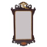 Georgian mahogany fret wall mirror, the bevelled rectangular plate within a gilt gesso slip