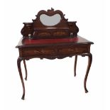 Edwardian stained walnut writing table, the raised back with a kidney shaped bevelled mirror over