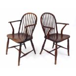 Matched pair of 19th century elm seat Windsor armchairs, with spindle backs, solid seats and