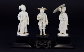 Three Japanese Ivory Figures standing on