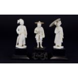 Three Japanese Ivory Figures standing on