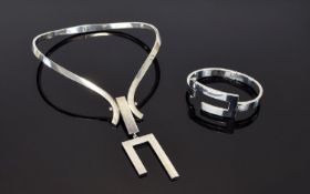 A Vintage Mexican Silver Statement Torque Necklace And Matching Bracelet Stylish modernist torque