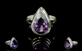 Ladies Silver And Amethyst Dress Ring Faceted teardrop/pear shaped Amethyst set in raised,