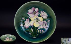 William Moorcroft Signed Large Footed Bowl ' Freesia ' Design on Green Ground.