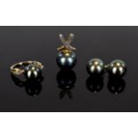 A 9ct Gold And Black Tahitian Pearl Jewellery Suite Three items in total comprising unusual ring,