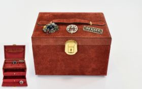 A Suede Jewellery Box And Three Brooches Top handle box in brick red suede with two internal