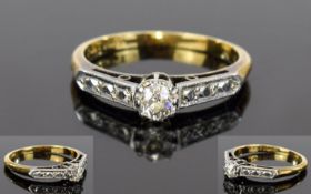 18ct Gold and Platinum Set Diamond Ring. The Central Round Cut Diamonds with a Further 3 Small
