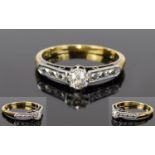18ct Gold and Platinum Set Diamond Ring. The Central Round Cut Diamonds with a Further 3 Small