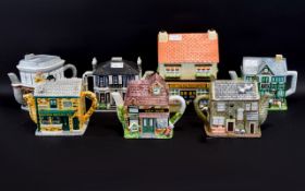 Collection Of 7 Novelty Teapots, Made By The Village & BBC Worldwide Limited.