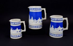 Set of Three Copeland Spode Graduated Blue and Cream Stoneware Jugs, each showing a panoramic