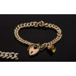 Antique Rose Gold Curb Bracelet with Heart Shaped Padlock and Charm In The Form of a Bell.